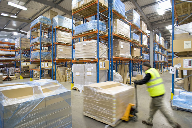 A worker moving inventory in a fulfillment center