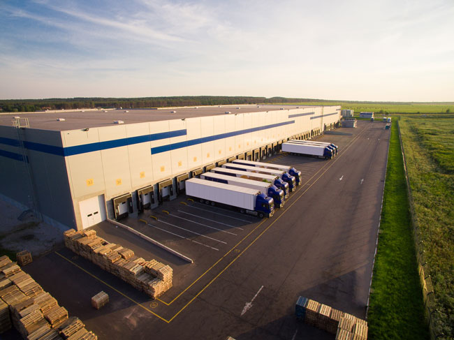 Fulfillment center loading docks with trucks